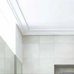 Plinth on the ceiling in the bathtub photo