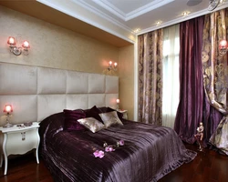 Purple curtains in the bedroom interior photo