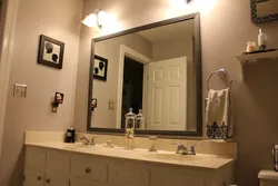 Bathroom mirror photo in the interior