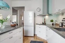 Refrigerator in the middle of the kitchen photo