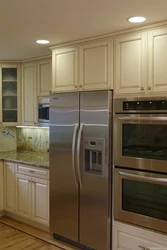 Refrigerator in the middle of the kitchen photo