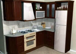 Corner kitchen design with refrigerator in the corner