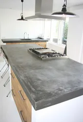 Concrete countertop in the kitchen interior photo