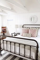 Bedroom design with metal black bed