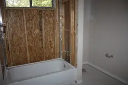 Bathroom made of plastic panels design in a wooden house
