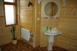 Bathroom made of plastic panels design in a wooden house