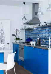 White Kitchen With Blue Apron Photo