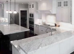 Photo of a kitchen with a black countertop and apron photo