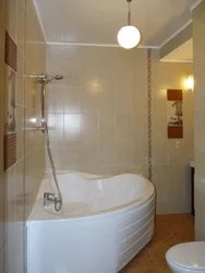 Corner bath with shower in the interior