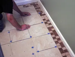 Laying tiles in the kitchen photo