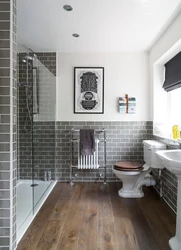 Laying tiles on a bathtub photo