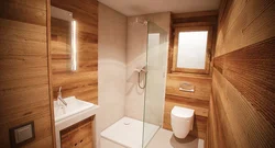 Finishing the bathroom with wooden panels photo