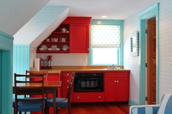 Coral-colored kitchen in the interior