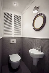 Toilet design in an apartment with pipes photo