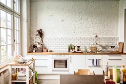 Wallpaper bricks in the kitchen in the interior