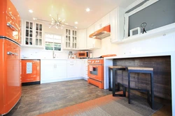 Kitchen design with orange refrigerator