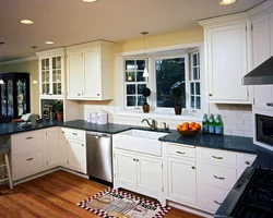 Kitchen design in a modern style with a window in the middle photo