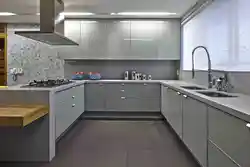 Gray kitchen in the interior combination with wallpaper