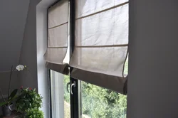 Roman blinds for plastic windows in the kitchen photo