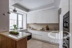 White kitchen up to the ceiling in the interior photo