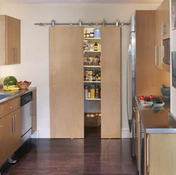 Doors to the kitchen photo of a small apartment