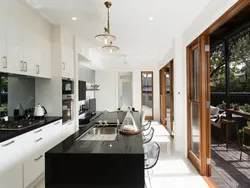 Combined living room with kitchen with access to the terrace photo