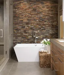 Bath interior with stone tiles