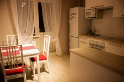 Kitchen 10 square meters photo with sofa and balcony