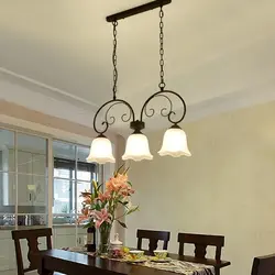 Pendant lamps in the kitchen above the table photo in the interior