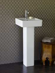 Sink with pedestal in the bathroom interior