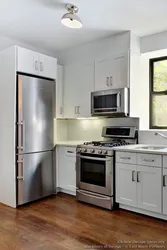 Kitchen interior refrigerator by the window