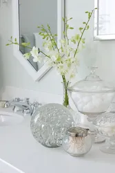Artificial flowers in the bathroom photo