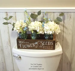 Artificial flowers in the bathroom photo