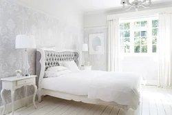 White wallpaper in the bedroom interior photo