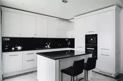 Kitchen design with black countertop and splashback