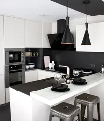 Kitchen design with black countertop and splashback