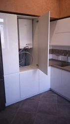 Kitchen design with a gas boiler in the corner on the wall