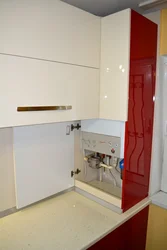 Kitchen design with a gas boiler in the corner on the wall