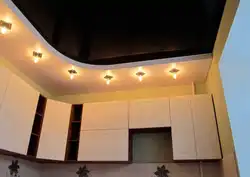 Plasterboard ceiling with lighting two-level design in the kitchen