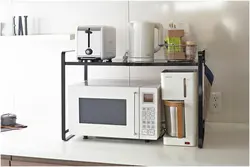 Microwave on brackets in the kitchen photo