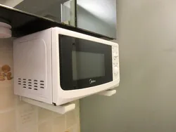 Ас үй фотосындағы жақшадағы микротолқынды пеш