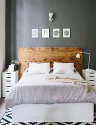 Gray bedroom with wood in the interior