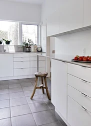 Photo of white tiles on the kitchen floor