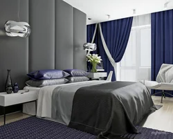 Blue curtains in the bedroom interior