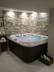 Bathtub with jacuzzi design in the apartment