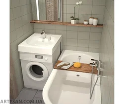 Washing machine under the sink in the bathroom photo