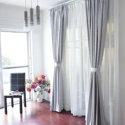 Design of curtains for a window with a balcony in the living room