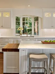 Kitchen with a large window in the middle design