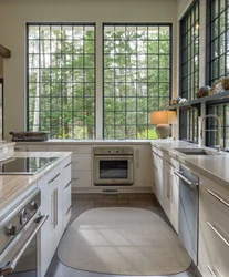 Kitchen with a large window in the middle design