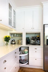 Corner cabinet in the kitchen interior photo